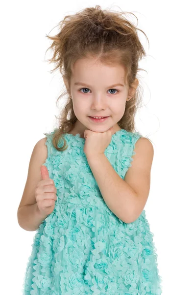 Adorable little girl holds her thumb up — Stock Photo, Image