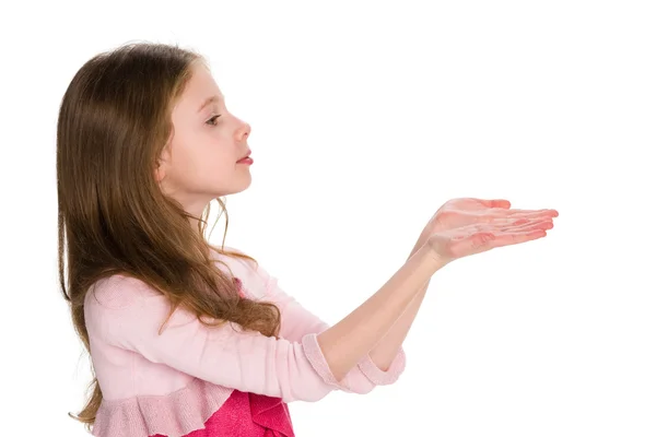 Young girl holds something in his hands — Stock Photo, Image