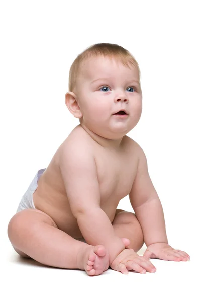 Niño pequeño se sienta — Foto de Stock