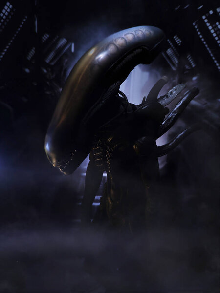 An alien on the Nostromo space station based on the movie "Alien". Around the steam and signal yellow ribbons. Industrial, space and biomechanics. Giger's biomechanics. The art of Giger.