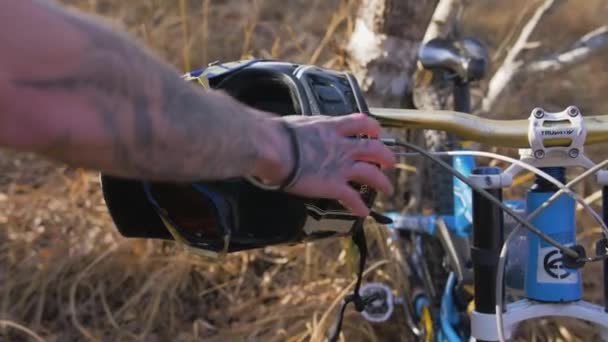 Extreme Bike Racer Takes Protective Helmet Steering Handle Bike Autumn — Stock Video