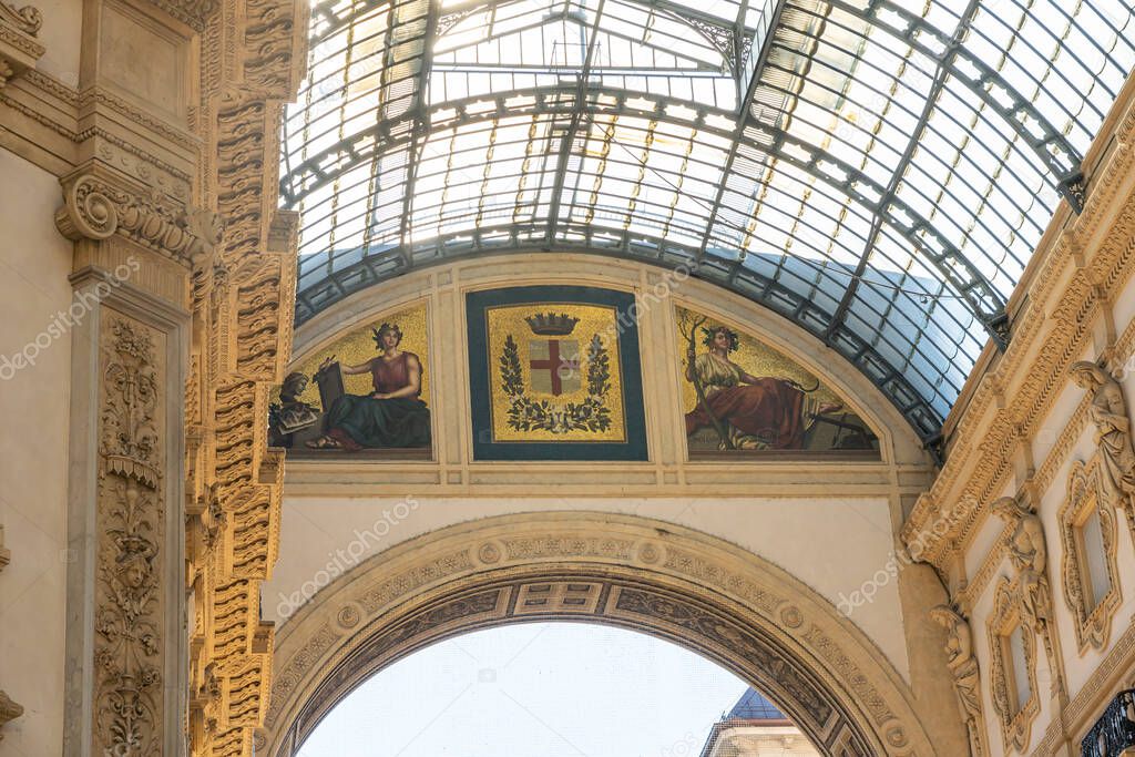 Interior architecture inside Galleria Vittorio Emanuele II, famous shopping mall in Milan, Italy