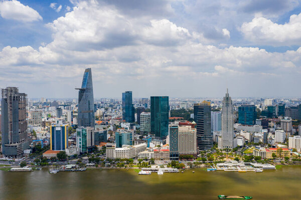 Aerial cityscape of Ho Chi Minh city with buildings and financial towers along Saigon river