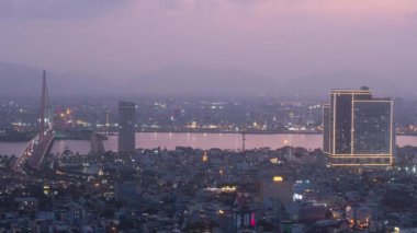 Spectacular cinematic and time-lapse view of a modern industrialized city in Vietnam with beautiful lights at night.