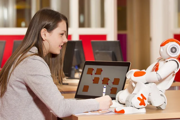 Child playing and learning with robot — Stock Photo, Image