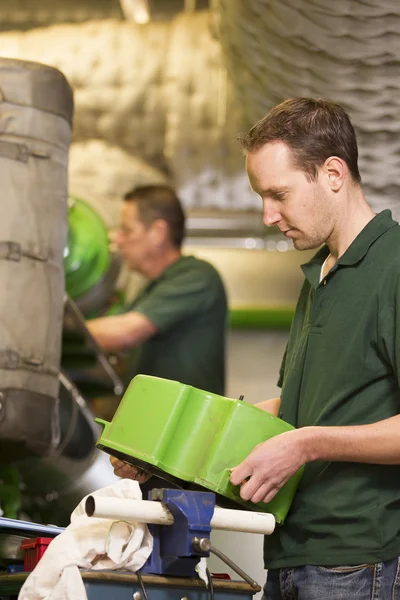 Two male technician repairing agriculture machinery — Stock Photo, Image