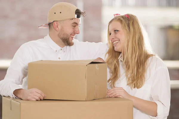 Happy young couple moving in their new home — Stock Photo, Image