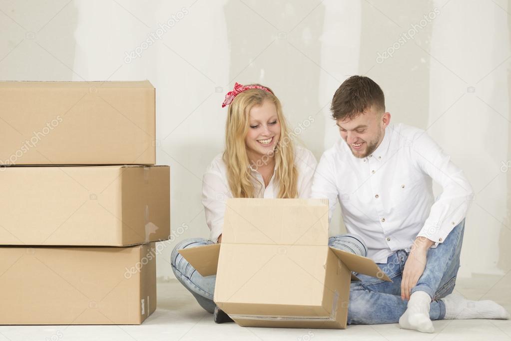 Happy young couple moving in their new home