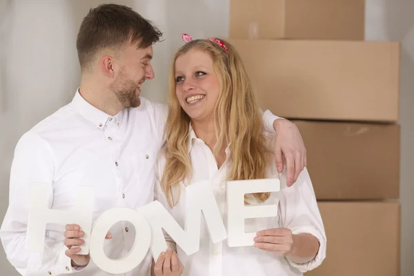 Happy young couple moving in their new home — Stock Photo, Image