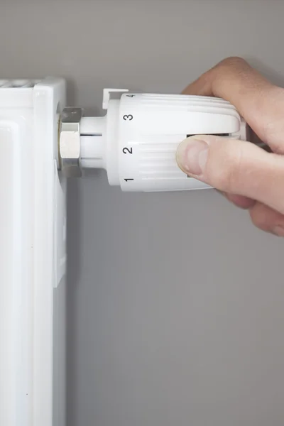 Hand Adjusting Thermostat At Home — Stock Photo, Image