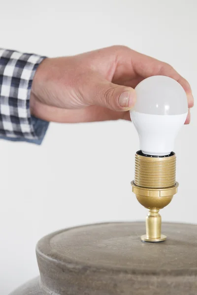 Hand Adjusting Electric Bulb At Home — Stock Photo, Image