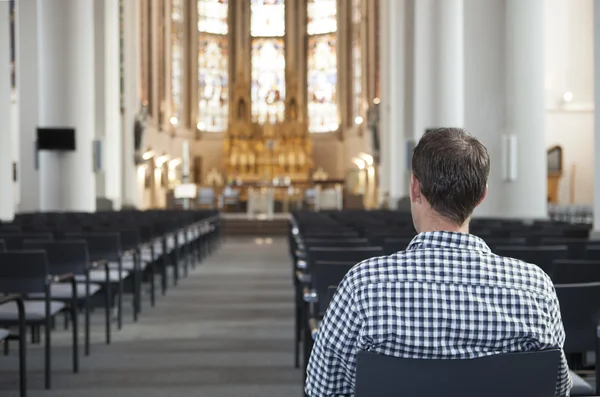 Man Sitting On Chair In Front Of Altar — Stock Photo, Image