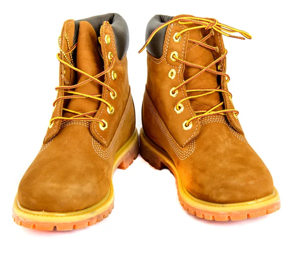 Brown ladys boots with shoelace on white background. Stock Photo