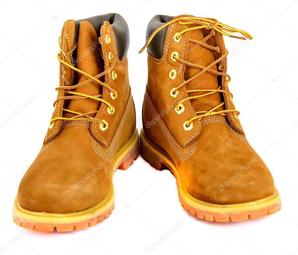 Brown ladys boots with shoelace on white background.