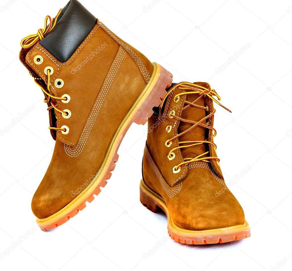 Brown ladys boots with shoelace on white background.