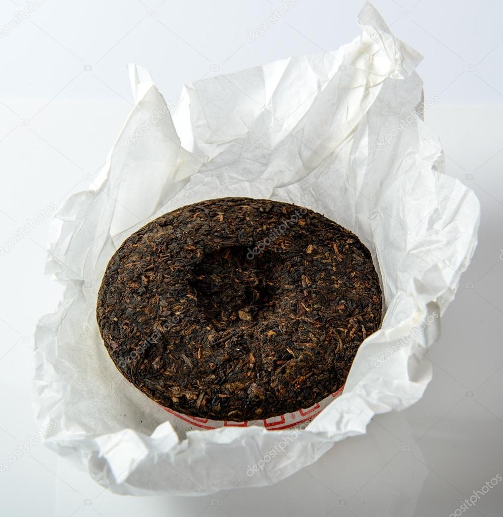 Chinese Puer Tea Cake In Unwrapped Packing On White Background Stock Photo By C Mivr