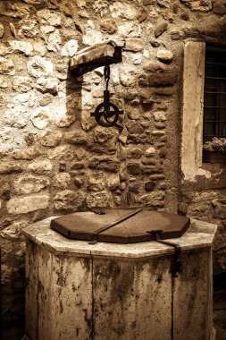 The old well in the medieval town of Besalu, Catalonia, Spain clipart