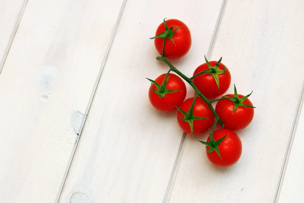 Tomatoes on wood — Stock Photo, Image