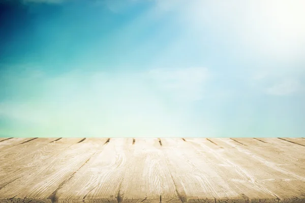 Wooden table with beautiful cloudy sky — Stock Photo, Image