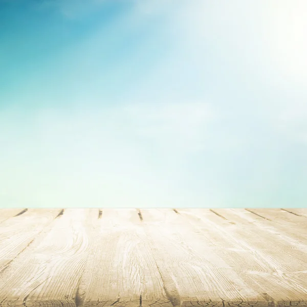 Wooden table with beautiful cloudy sky — Stock Photo, Image