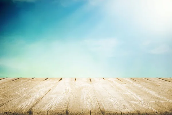 Wooden table with beautiful cloudy sky — Stock Photo, Image