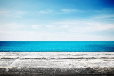 Table near sea with blue sky