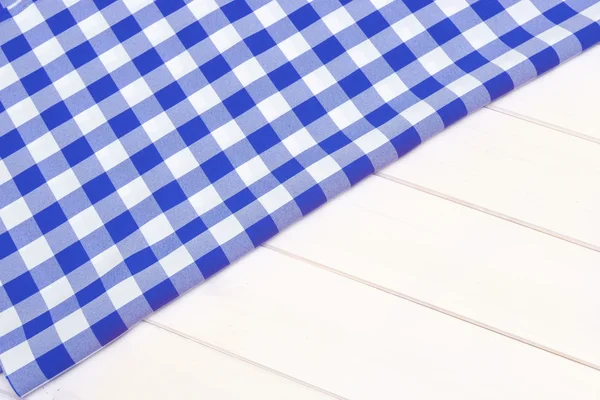 Blauwe tafellaken op hout — Stockfoto