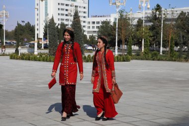 Ashgabad, Turkmenistan - October 10, 2014. Two young girls in na clipart