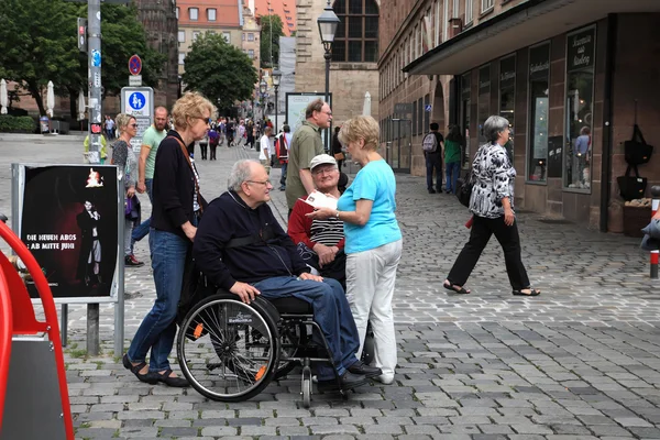 NURNBERG, GERMANY - JULY 13 2014: Tourists in wheelchairs on Hau — Stock Photo, Image