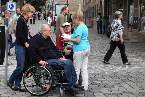 NURNBERG, GERMANY - JULY 13 2014: Tourists in wheelchairs on Hau — Stock Photo, Image