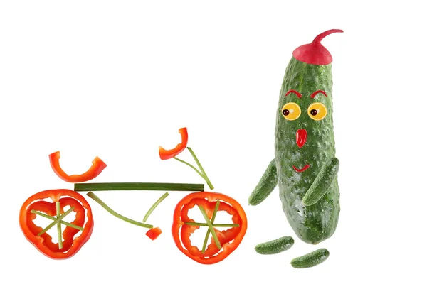 Little funny cucumber standing with bicycle. The picture is made — Stock Photo, Image