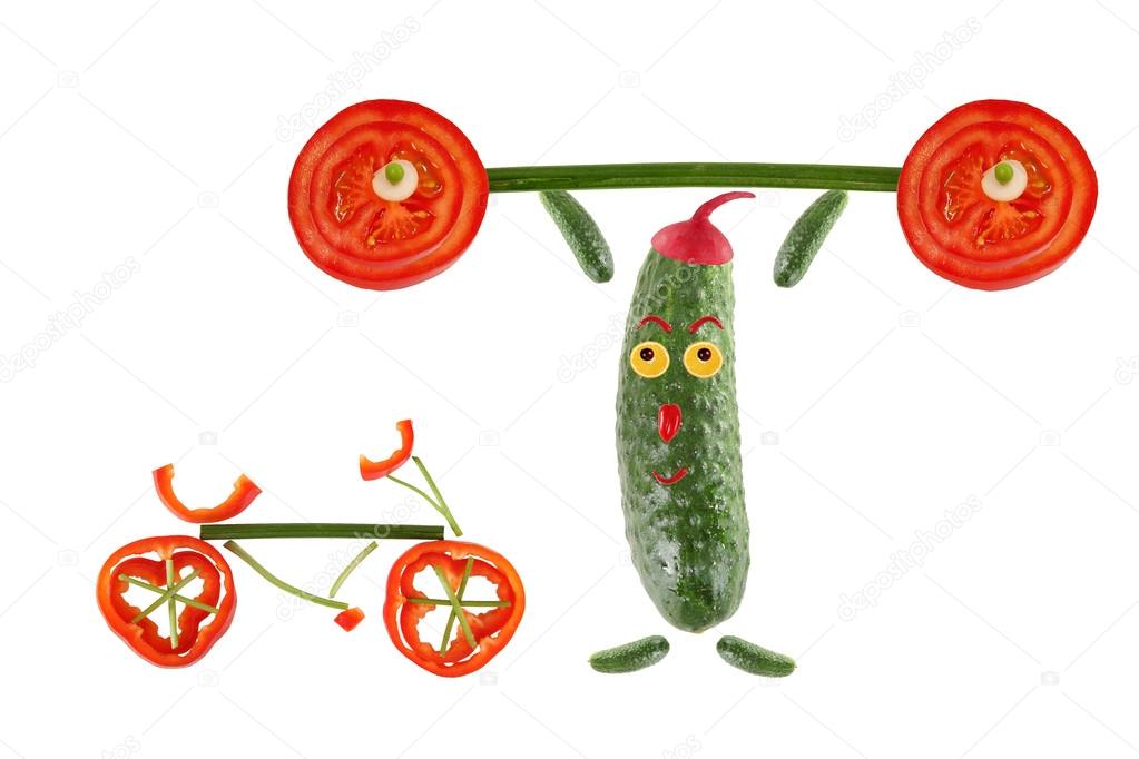 Little funny cucumber raises the bar next to it stands  a bicycl