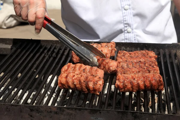 Cooking delicious  sausages  on the barbecue grill. Selective fo — Stock Photo, Image