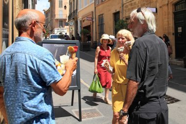  Aix-en-Provence, FRANCE - JULY 1, 2014. Happy middle-aged peopl