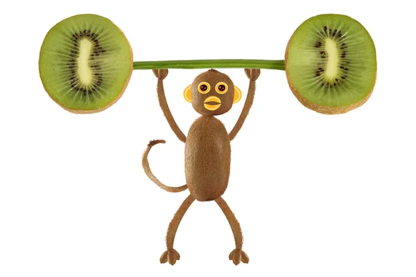 Zdravé stravování. Legrační malá opice z kiwi vyvolat ba — Stock fotografie