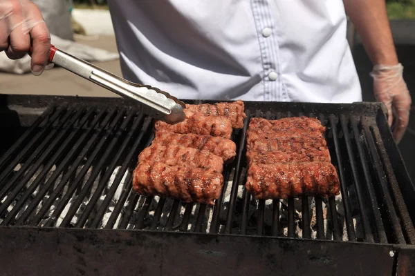 Cooking delicious  sausages  on the barbecue grill. Selective fo — Stock Photo, Image