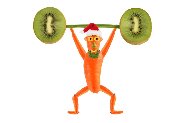 Gesunde Ernährung. Lustiger kleiner Mann hebt Kiwi-Stange. frohes neues Jahr — Stockfoto