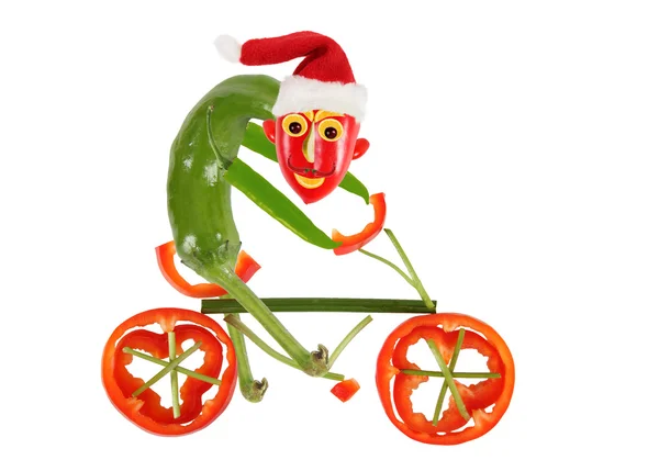Pimienta graciosa en una bicicleta. Feliz Año Nuevo — Foto de Stock