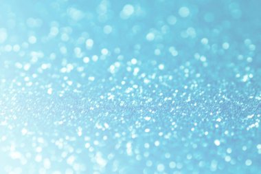 Mavi parıltılı soyut arka plan yumuşak odak. Yumuşak ışık. Soyut arkaplan mavi bokeh daireler