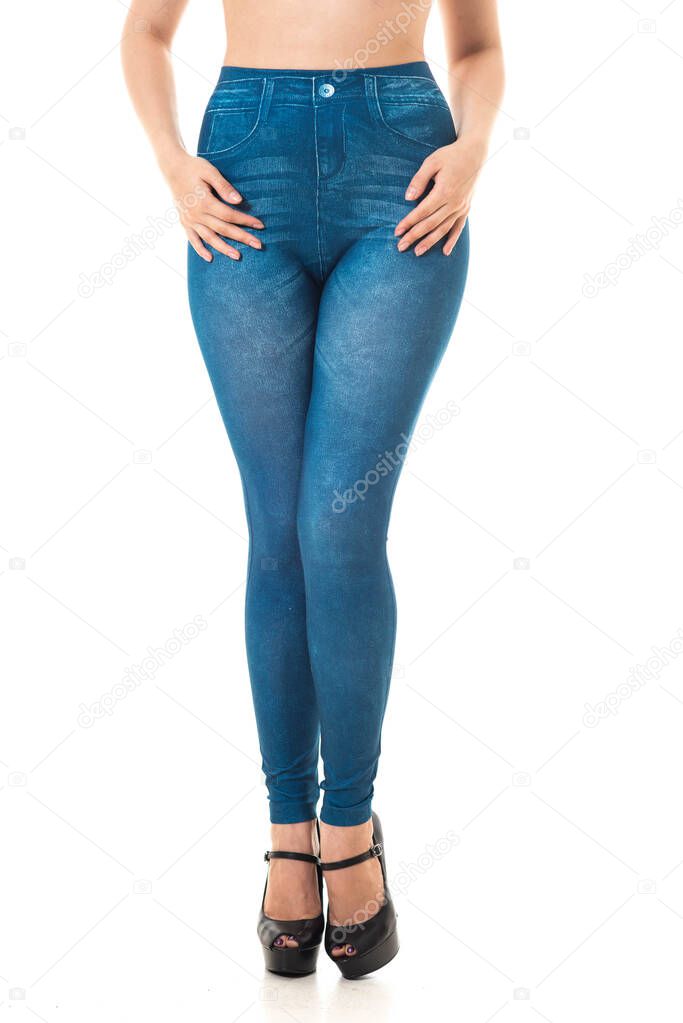 Womans legs wearing high heel shoes and textured leggins