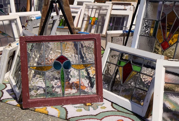 Old windows frames with stained glass at flea market — Stock Photo, Image