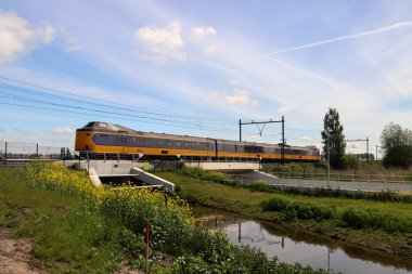 ICM Intercity Koploper of NS between Gouda and The Hague in the Zuidplaspolder at future new village to be build