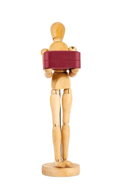 Wooden dummy carrying red gift box — Stock Photo, Image