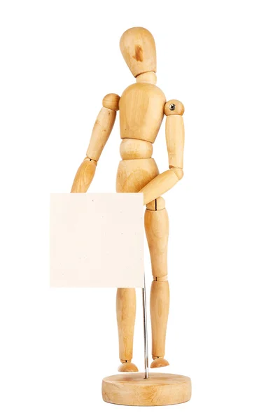 Wooden dummy holding paper — Stock Photo, Image