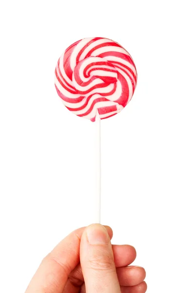 Hand holding spiral lollipop — Stock Photo, Image