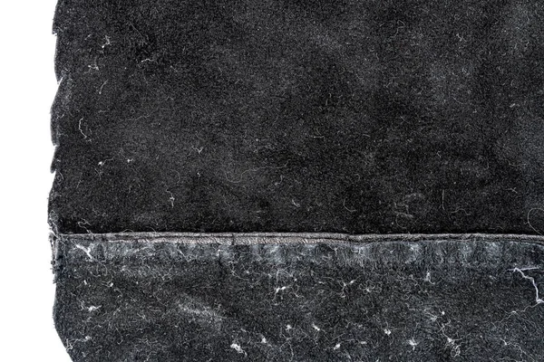 白い背景に隔離された厄介な黒い革のピース 砕いた素材の質感 — ストック写真