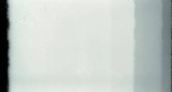 フィルムのストリップの質感の背景に大粒でほこりのあるブランク — ストック写真