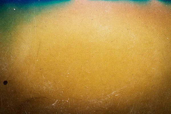 Abstract colorful scratched film texture background with heavy grain, dust and light leak