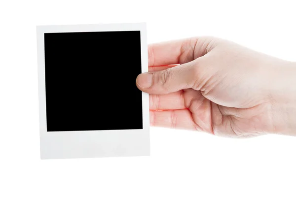 One instant photo in hand — Stock Photo, Image