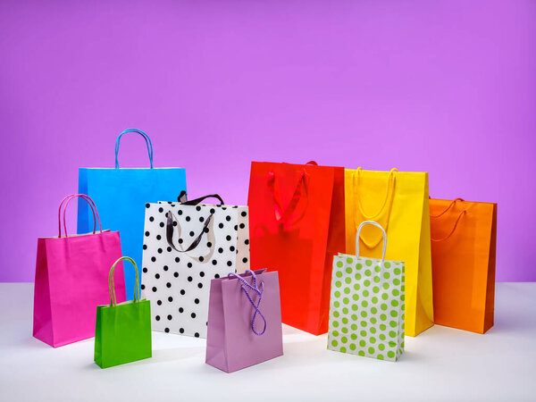 Colorful paper bags for shopping and gifts. Online sales concept. Goods on sale.